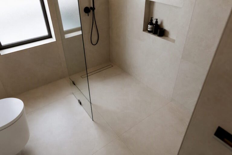 Modern curbless shower with frameless glass