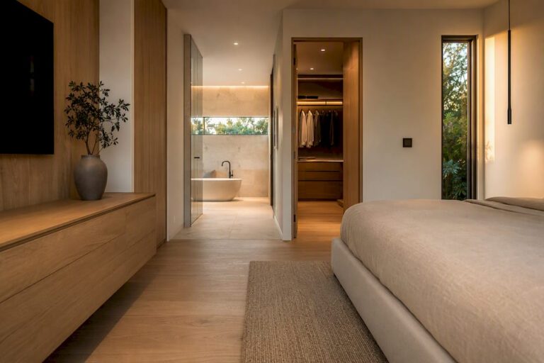 Modern primary suite with connected bathroom and closet